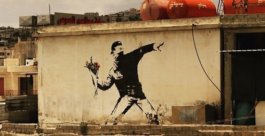Banksy's Flower Thrower: An Analysis of the Artwork - Artsper Magazine
